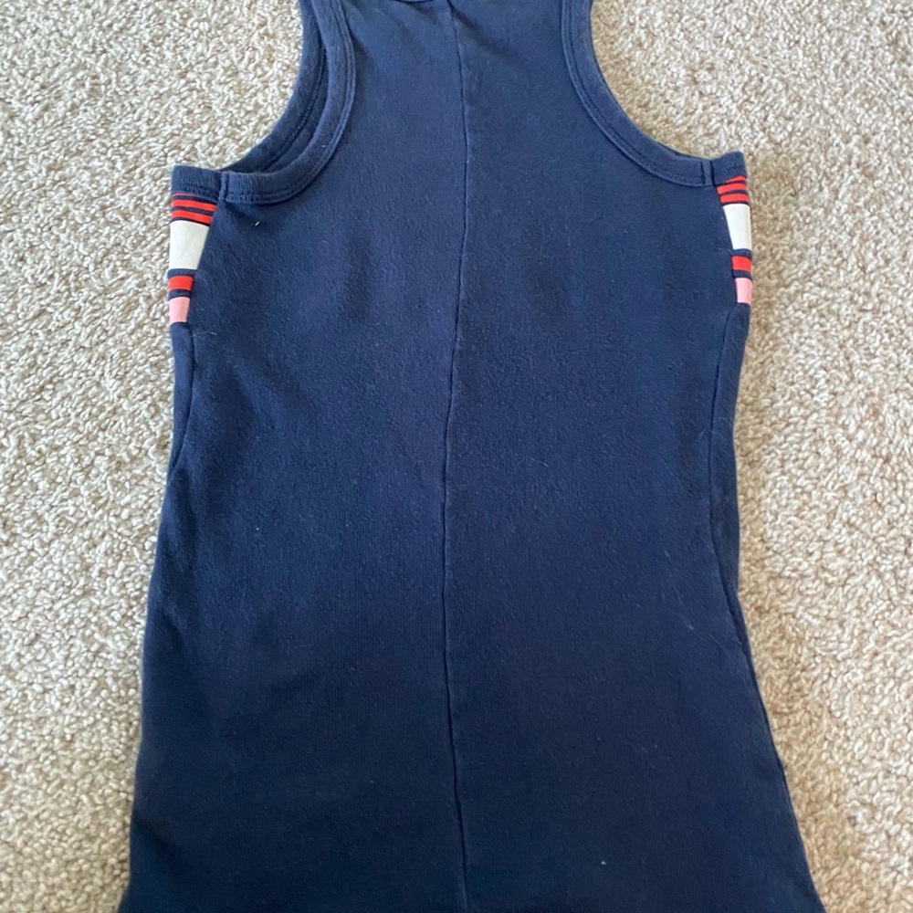 This is a navy blue tank top with red and white and pink strip design. Size XS.
